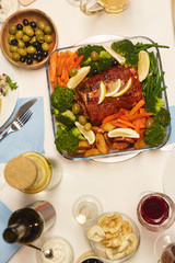 Wall Mural - High angle view of dish with meat and vegetables on the table prepared for holiday dinner