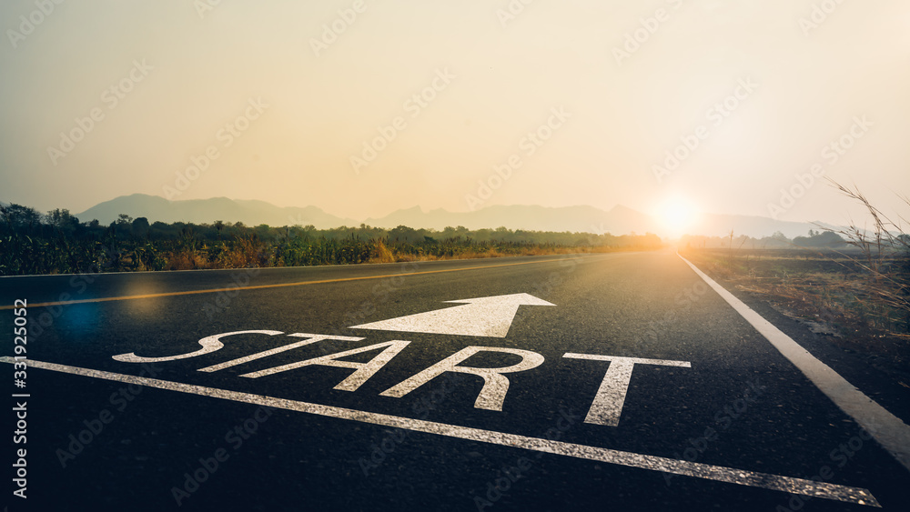 Concept of start straight and beginning for cooperation.Start text on the highway road concept for planning and challenge or career path,business strategy,opportunity and change in sunset background. - obrazy, fototapety, plakaty 
