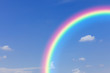 © pushish images - Blue sky and clouds and rainbow background