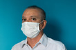 © Xaxas - Recife / Pernambuco / Brazil. March, 20, 2020. Images of a 54-year-old middle-aged male model wearing protective hospital masks and gloves. Protection against Covid-19.