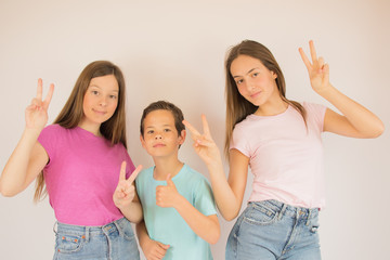 Beautiful boy and girls looking into camera