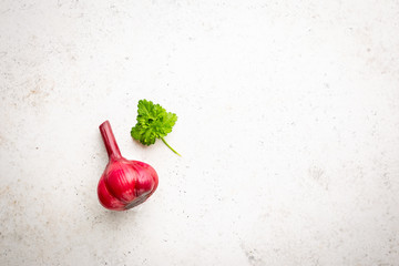 Poster - Red homemade pickled garlic on a white background, top view