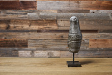 The Mineral Pyrite Is A Cylindrical Figurine On A Wooden Background