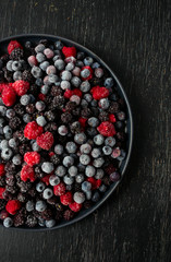 Wall Mural - frozen raspberries, blackberries and blueberries close up