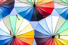 Colorful Umbrellas Blue, Green, Red, Rainbow Umbrellas Background Street With Umbrellasin The Sky Street Decoration.