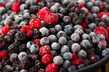 Wall Mural - frozen raspberries, blackberries and blueberries close up