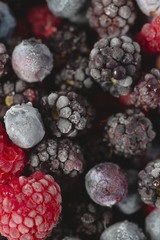 Wall Mural - frozen raspberries, blackberries and blueberries close up