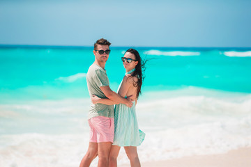 Young couple on white beach during summer vacation.