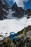 Fototapeta Góry - The Tatras in April with naked rocks and snow in the valley.