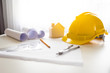 © TWEESAK - Safety helmets and drawing equipment for engineers.