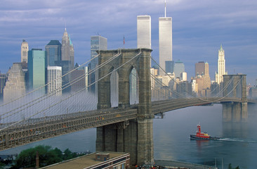 Fototapete - View of New York skyline, Brooklyn Bridge over the East River and tugboat in fog, NY