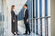 © Serhii - The business people walk in the office hall