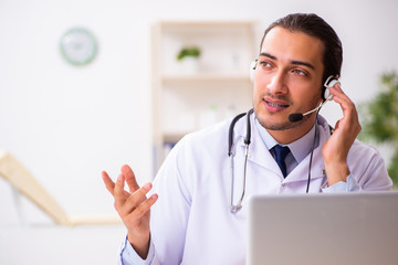 Young doctor listening to patient during telemedicine session