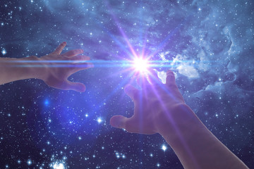 a human hand cover the light stroke frome the night star sky. elements of this image furnished by na