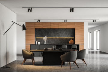 White kitchen with bar and dining table