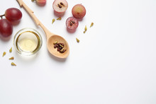 Composition With Natural Grape Seed Oil On White Background, Top View. Organic Cosmetic