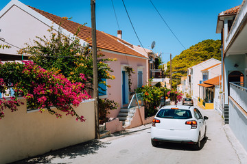 Wall Mural - Vacation travel with rent car. Rental hired car in Assos town. Discover Mediterranean Islands. Summer time holiday trip