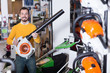 © JackF - Smiling man choosing leaf blower