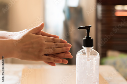 Asian people using alcohol gel,using alcohol gel clean wash hand sanitizer anti virus bacteria.