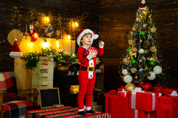 First memory of childhood. Winter delivery service for kid. Happy child with Christmas gift box. Cute little kid celebrating Christmas.