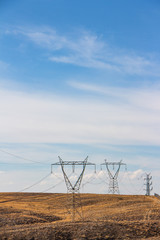 Electric tower in a landscape and blue sky