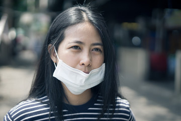 Asian woman wear protective face mask., with copy space