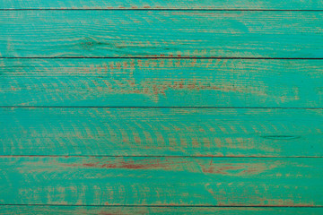 Vintage green wood background texture with knots and nail holes. Old painted wood wall. Brown abstract background. Vintage green wooden dark horizontal boards. Front view with copy space. Background f