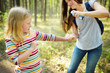 © MNStudio - Mother applying insect repellent to her daughter before forest hike summer day. Protecting children from biting insects at summer. Using bug spray. Active leisure with kids.