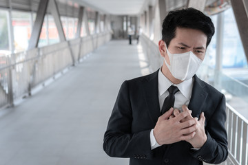 Asian man business in city of thailand,Handsome man wearing protection medical mask covid-19 or coronavirus from Infected person,corona protected Help protect For world and people stop virus warning