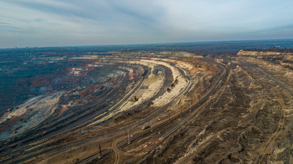 Wall Mural - An open-cast mine quarry using an open-pit mining of ore type according to a height study