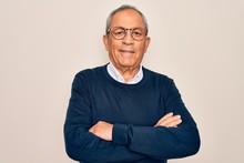 Senior Handsome Grey-haired Man Wearing Sweater And Glasses Over Isolated White Background Happy Face Smiling With Crossed Arms Looking At The Camera. Positive Person.