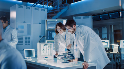 Poster - Diverse International Team of Industrial Scientists and Engineers Wearing White Coats Working on Heavy Machinery Design in Research Laboratory. Professionals Using 3D Printer, Computers and Microscope