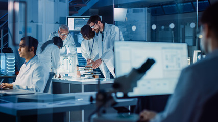 Poster - In Technology Research Laboratory: Diverse Team of Industrial Scientists, Engineers, Developers Gather Around Illuminated Table and Inspect Blueprints, Adjust 3D Printer, Choose Component Motherboard