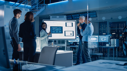 Poster - Engineers Meeting in Technology Research Laboratory: Male Engineer Leads Presentation Using Digital Whiteboard, Shows Machine Blueprint, Data Analytics and Neural Network while Colleagues Listening