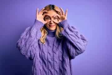 Poster - Young beautiful blonde woman wearing casual turtleneck sweater over purple background Trying to open eyes with fingers, sleepy and tired for morning fatigue