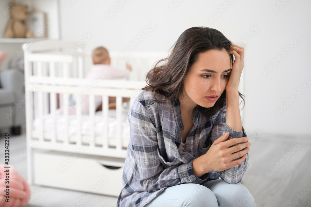 Young woman suffering from postnatal depression at home - obrazy, fototapety, plakaty 