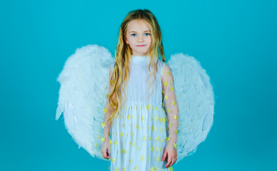 cute child girl posing with angel wings. beautiful little angel. face of beautiful little angel girl