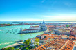 Aerial view of Venice city historical city centre, Santa Maria della Salute Catholic church on Punta della Dogana between Grand Canal and Giudecca Canal, Veneto Region, Italy. Venice cityscape.