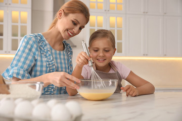 Poster - Mother and daughter making dough together in kitchen