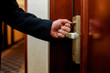 © Svitlana - Convenient entrance. Cropped shot of businessman hand opening the door using key card while entering his room in a luxury hotel