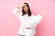 © luismolinero - Young woman in pajamas isolated on pink background with tired and sick expression