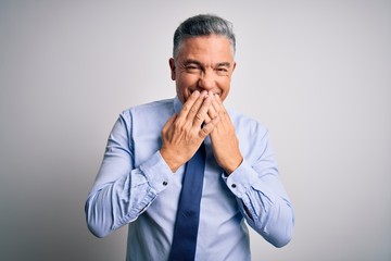 Poster - Middle age handsome grey-haired business man wearing elegant shirt and tie laughing and embarrassed giggle covering mouth with hands, gossip and scandal concept