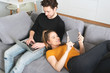 © Proxima Studio - Couple using home internet with mobile devices
