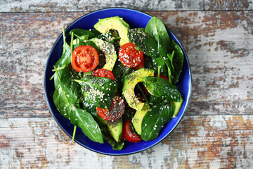 Healthy salad with avocado, spinach and cherry tomatoes. Vegan Salad. Super food. Healthy diet.