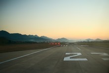 Airport Runway At Dawn. Travel, Air Transport, Aeronautical Industry Concept.