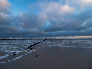 Sunrise at the estuary of the Piasnica River, Poland, Debki. Remains of the pier.