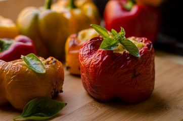 peppers stuffed with chicken with potatoes and spices. red green, yellow, vegan food