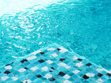  Background Of Rippling Water Surface Over Blue Tiled At Bottom Of Swimming Pool.