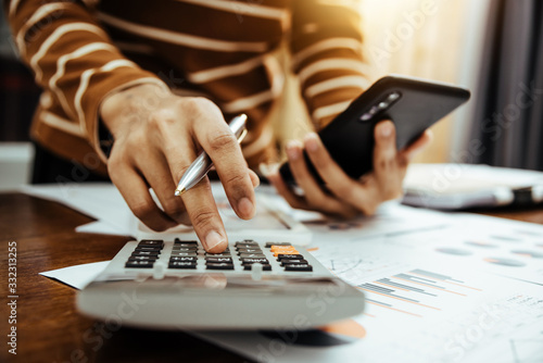 Cuadros en Lienzo Female accountant or banker making calculation of finance and economy banking concept