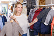 © JackF - Woman shopping in kids clothing store